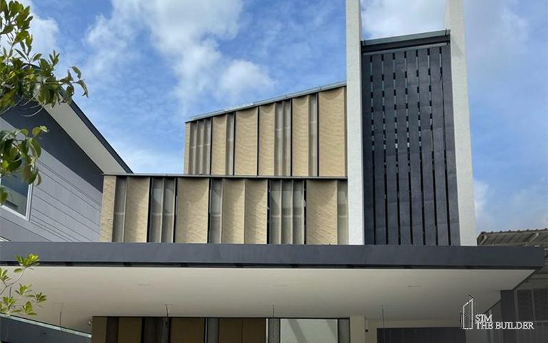 Contemporary house with vertical slats and a sleek black-and-beige facade.
